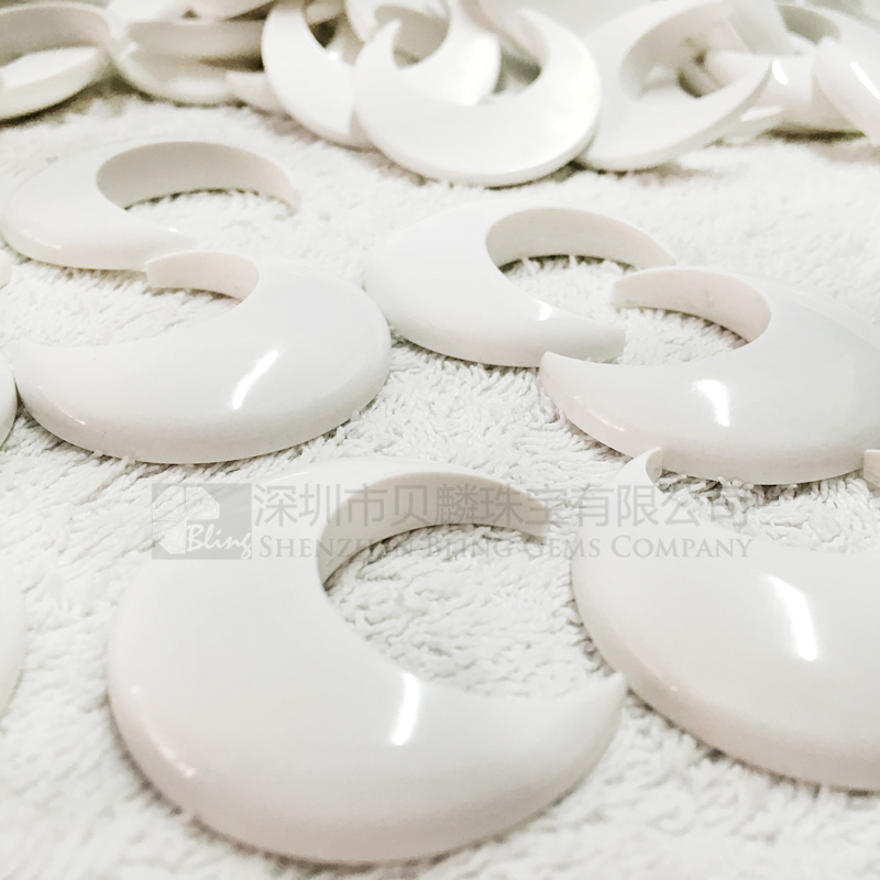 Synthetic white turquoise crescent-shaped pendants