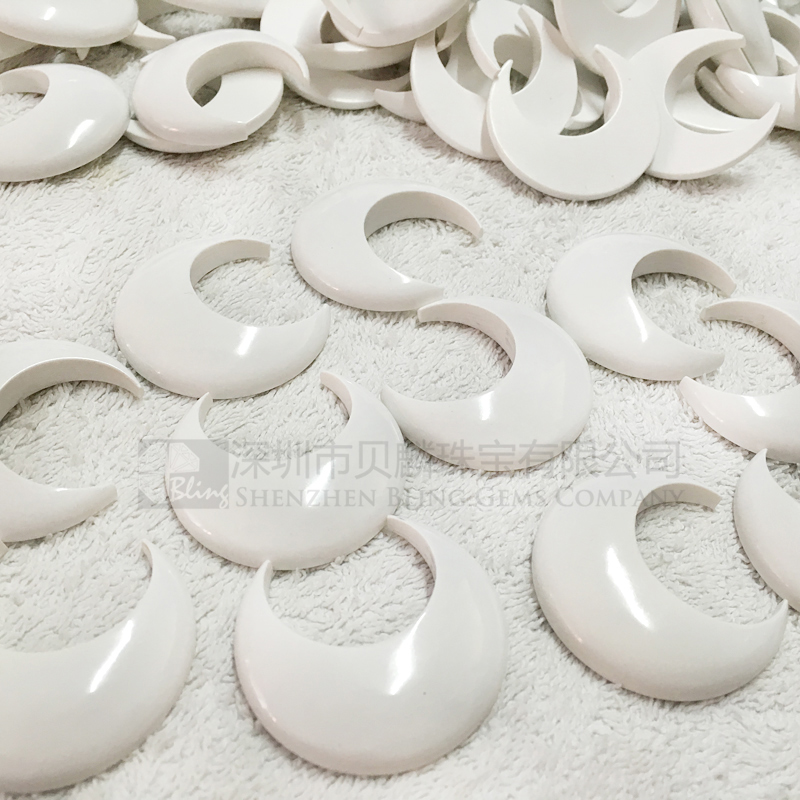 Synthetic white turquoise crescent-shaped pendants